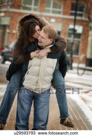 Stock Image - Couple on winter walk. Fotosearch