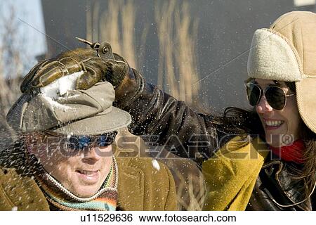 Stock Photograph - Couple Outdoors enjoying Winter. Fotosearch