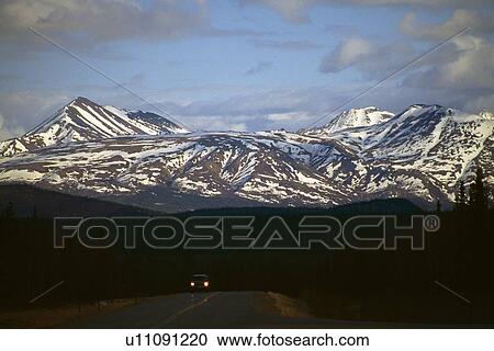 Denali National Park road with headlights, mountain backdrop. View Large Photo Image Stock Image - Denali National Park road with headlights, mountain backdrop.. Fotosearch