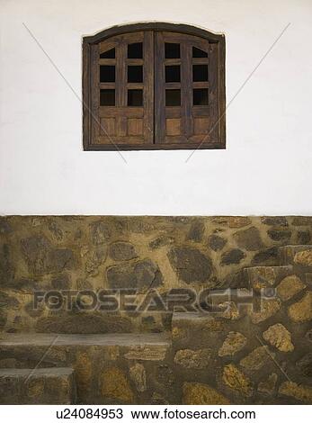 Stock Image - Exterior of a stucco building. Fotosearch