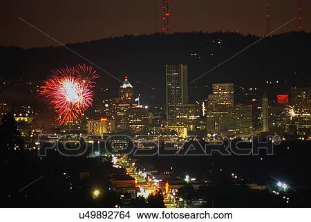 Picture - Fireworks display, city lights. Fotosearch