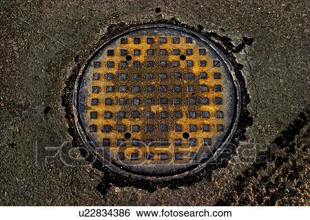 Stock Photograph - Man hole cover. Fotosearch