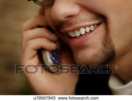 Man talking on cell phone View Large Photo Image Stock Image - Man talking on cell phone. Fotosearch