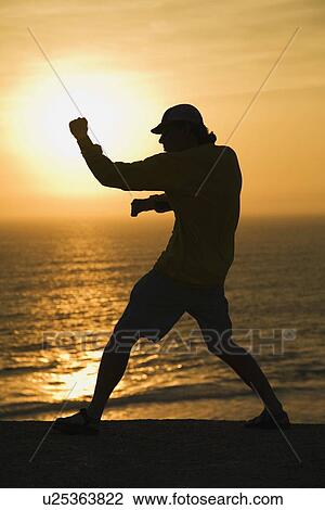 Martial artist on beach View Large Photo Image Stock Image - Martial artist on beach. Fotosearch