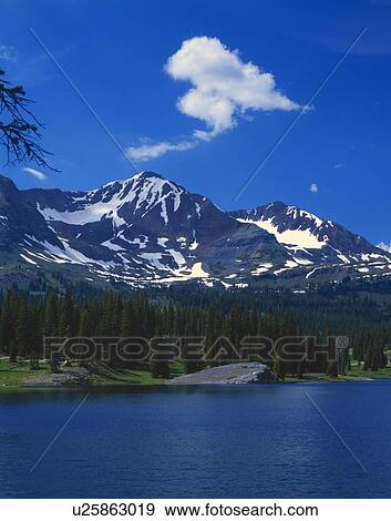 Mountain peaks and peaceful lake View Large Photo Image Stock Photo - Mountain peaks and peaceful lake. Fotosearch