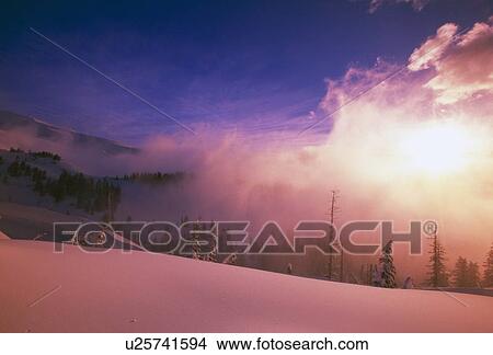 Pink sunrise through fog at Cascade mountains View Large Photo Image Picture - Pink sunrise through fog at Cascade mountains. Fotosearch