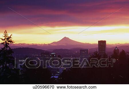 Stock Image - Portland skyline in sunset with Mount Hood in the distance. Fotosearch