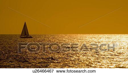 Sailboat at Sunset View Large Photo Image Stock Photo - Sailboat at Sunset. Fotosearch