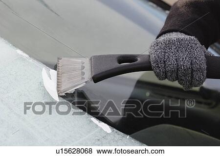 Scraping frost on car window View Large Photo Image Stock Photo - Scraping frost on car window. Fotosearch