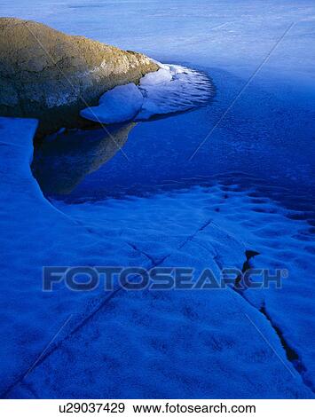 Stock Photo - Shoreline with Ice, sandstone pattern. Fotosearch