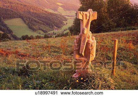 Stock Image - Statue on the top of a hillside. Fotosearch