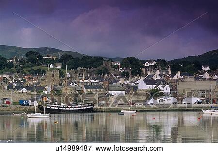 Stock Photo - Stormy clouds over village. Fotosearch