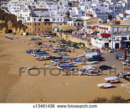 Stock Photo - Traditional Algarve fishing boats on a Portugeuse beach. Fotosearch