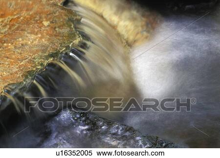 Water streaming over rocks View Large Photo Image Stock Photography - Water streaming over rocks. Fotosearch