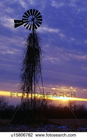 Stock Image - Windmill silhouette in sunset.. Fotosearch