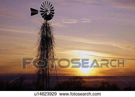 Stock Photo - Windmill silhouette in sunset.. Fotosearch