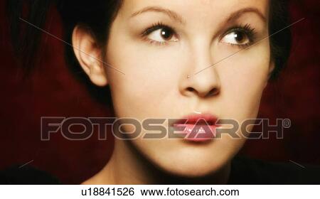 Stock Photograph - Woman looking up. Fotosearch