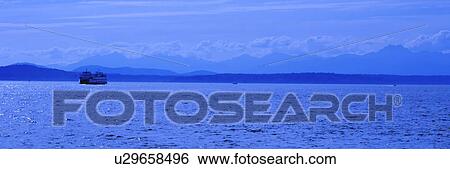 A boat in a scenic lake View Large Photo Image Stock Photograph - A boat in a scenic lake. Fotosearch