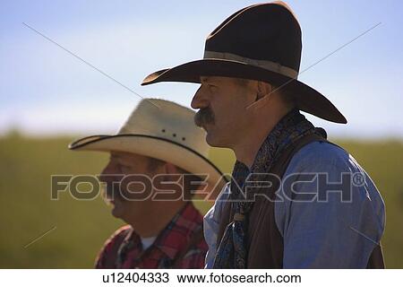 Stock Image - A pair of cowboys. Fotosearch