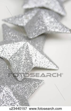 Stock Photo - A row of silver stars. Fotosearch