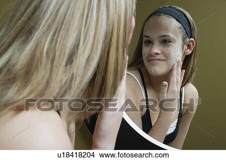 Applying facial moisturizer View Large Photo Image Picture - Applying facial moisturizer. Fotosearch
