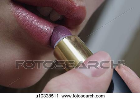 Applying lipstick View Large Photo Image Stock Image - Applying lipstick. Fotosearch