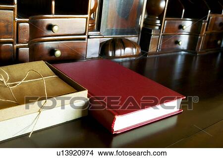 Picture - Books on a table top. Fotosearch