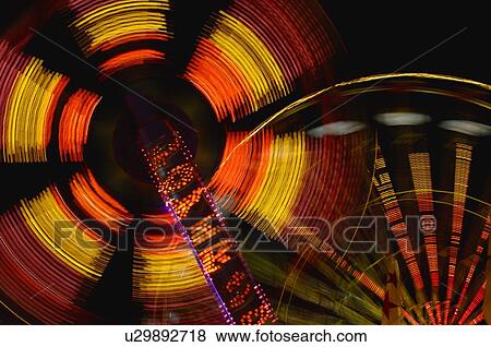 Bright lights in sky from ferries wheel View Large Photo Image Stock Photo - Bright lights in sky from ferries wheel. Fotosearch
