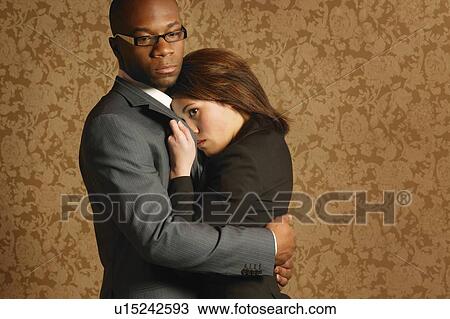 Business couple embracing View Large Photo Image Stock Image - Business couple embracing. Fotosearch