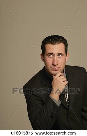 Businessman deep in thought View Large Photo Image Stock Photography - Businessman deep in thought. Fotosearch
