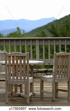 Stock Photo - Chairs on a deck. Fotosearch