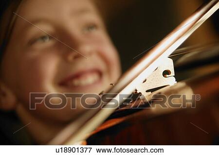 Stock Photo - Child playing violin. Fotosearch