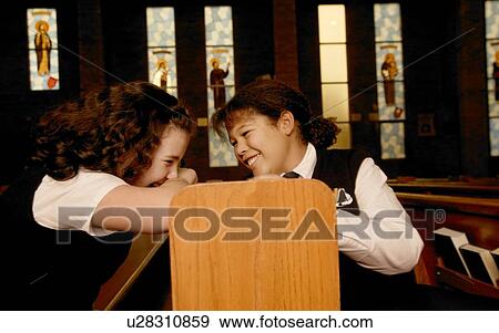 Stock Photo - Children goofing off in mass. Fotosearch