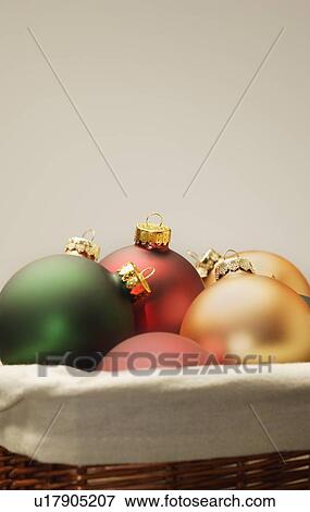 Stock Photo - Christmas decorations in a basket. Fotosearch