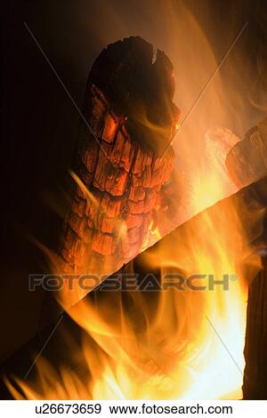 Closeup of a log burning in fire View Large Photo Image Stock Photo - Closeup of a log burning in fire. Fotosearch