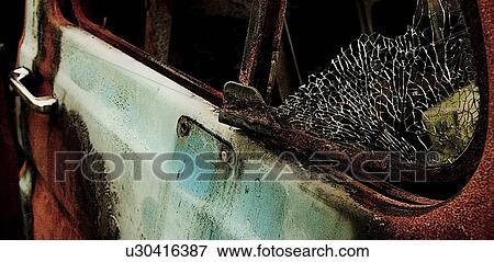 Stock Photo - Closeup of a shattered window. Fotosearch