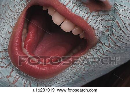 Closeup of face with facial masque View Large Photo Image Stock Photo - Closeup of face with facial masque. Fotosearch