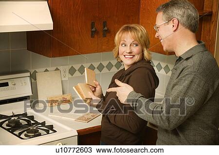 Couple choosing tile for kitchen View Large Photo Image Stock Image - Couple choosing tile for kitchen. Fotosearch