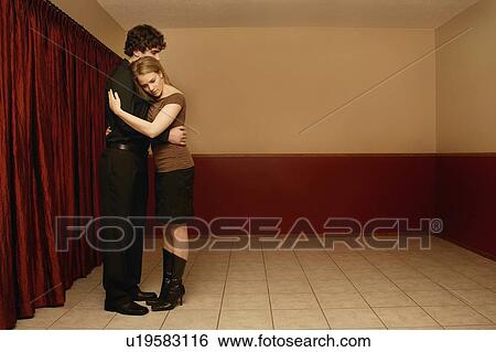 Stock Photograph - Couple holding each other. Fotosearch