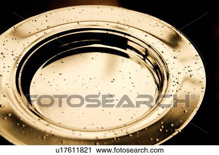 Stock Image - Empty communion plate. Fotosearch