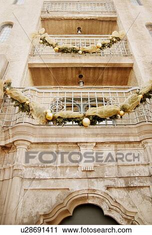 Garland on an old building View Large Photo Image Stock Image - Garland on an old building. Fotosearch
