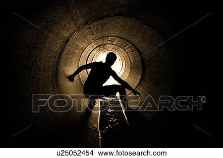 Picture - Hiding in a drain pipe. Fotosearch
