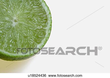 Lime cut in half View Large Photo Image Stock Photograph - Lime cut in half. Fotosearch