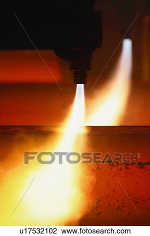 Stock Image - Machinery working in a molten steel factory. Fotosearch
