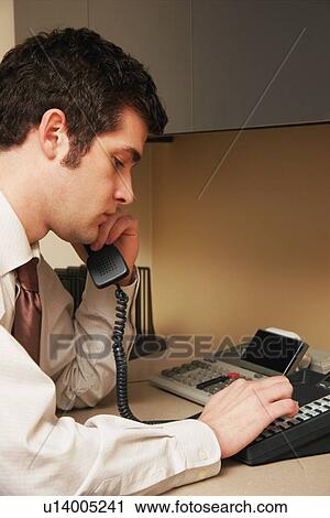 Man dialing phone number View Large Photo Image Stock Image - Man dialing phone number. Fotosearch