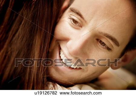 Stock Image - Man gives a hug. Fotosearch