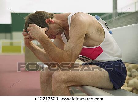 Man resting after race View Large Photo Image Stock Image - Man resting after race. Fotosearch