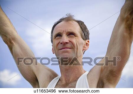 Stock Photograph - Man wins race. Fotosearch