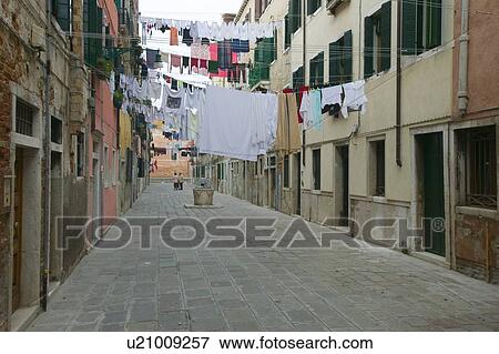 Pedestrial street with hanging laundry View Large Photo Image Stock Photo - Pedestrial street with hanging laundry. Fotosearch