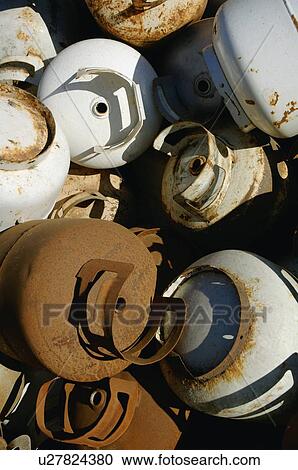 Stock Image - Pile of used propane bottles. Fotosearch